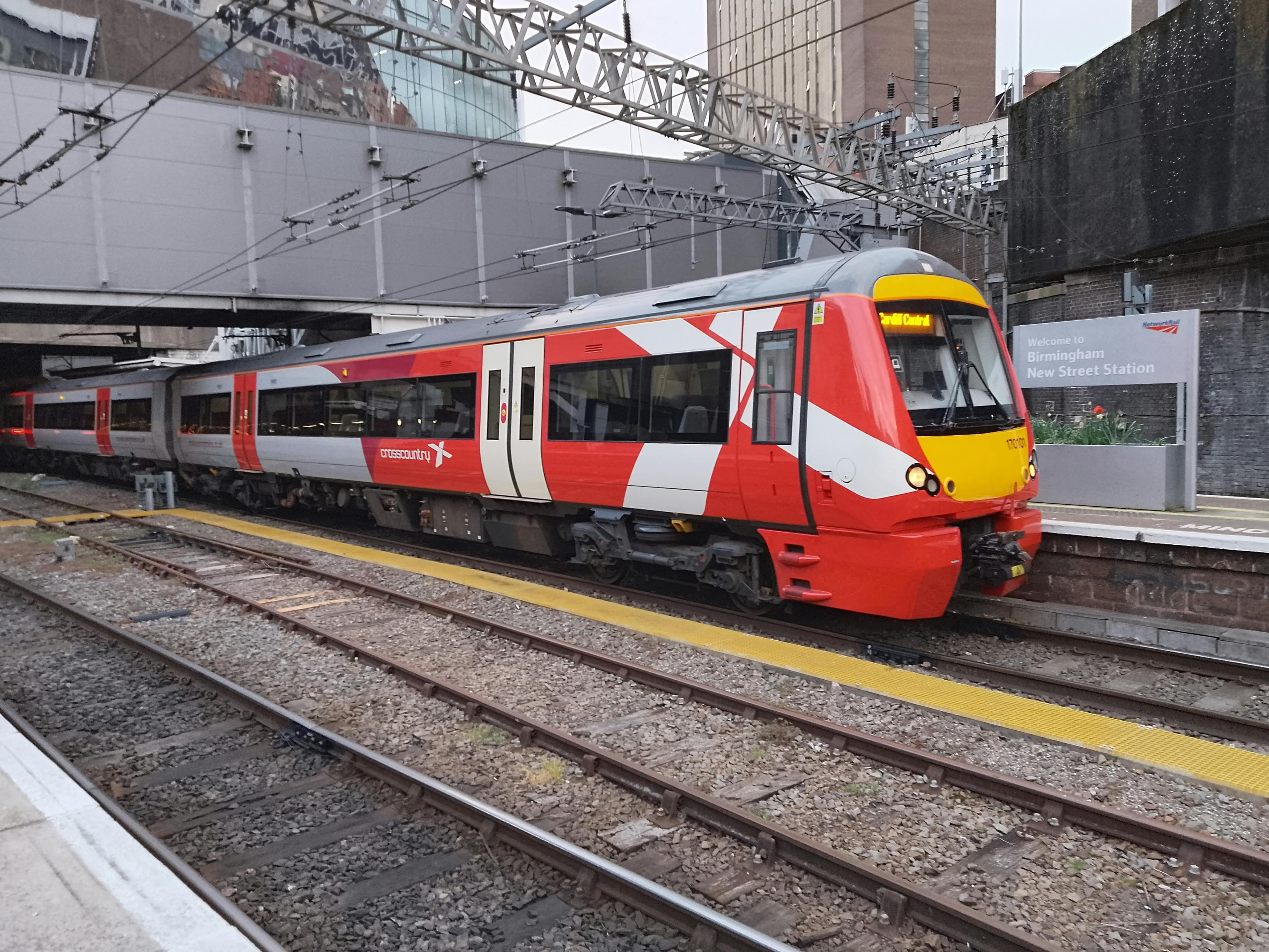 UK passenger train at a station platform
